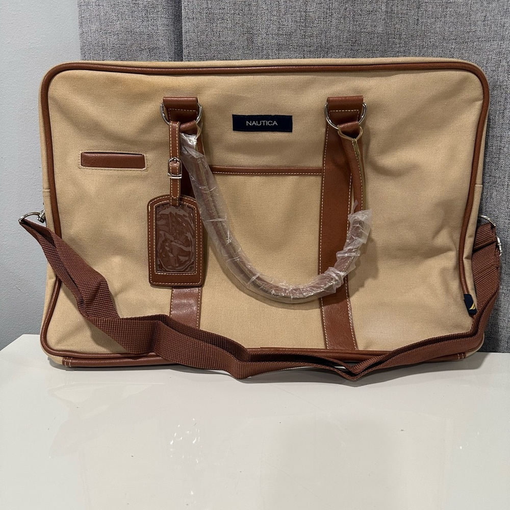Nautica khaki canvas and tan leather duffel bag
NWT.